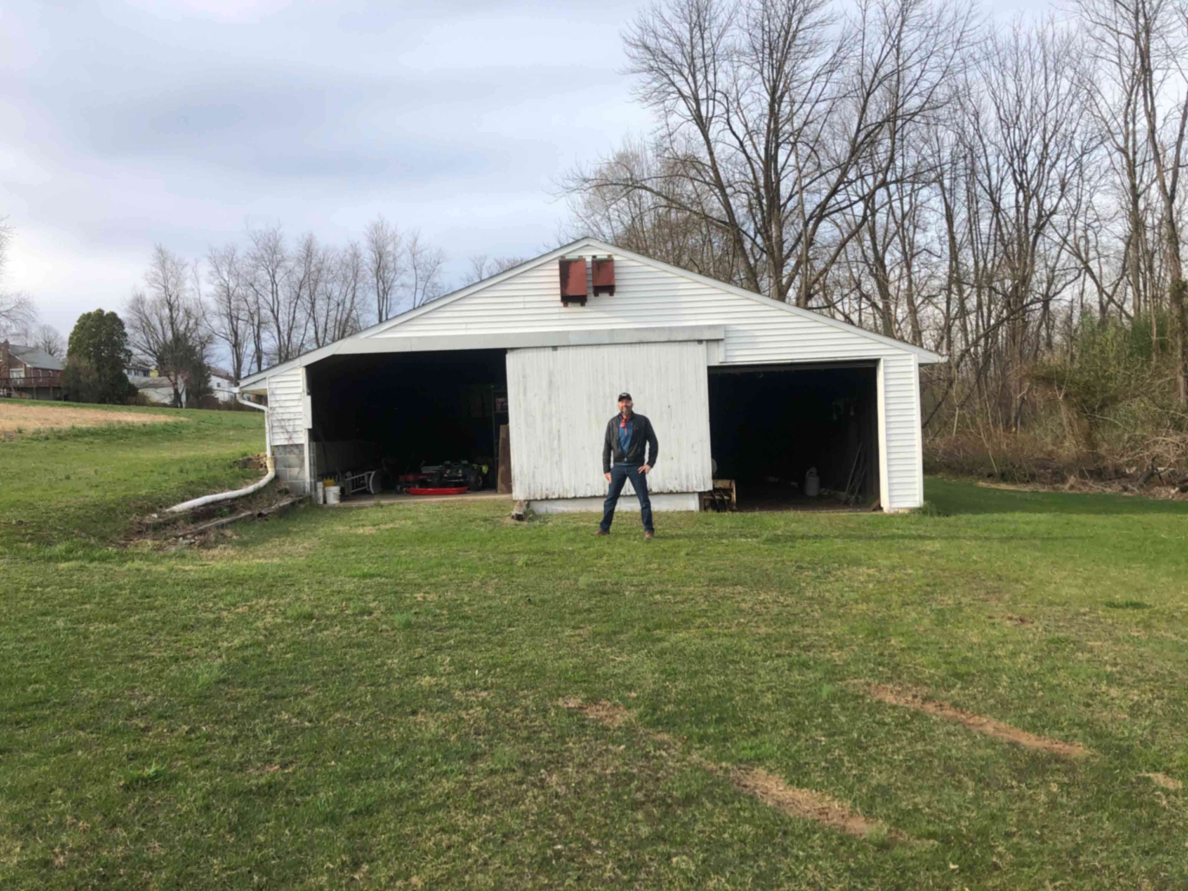 Farmer Mike in front of his barn